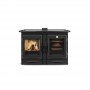Cuisinière à bois Alaska 12 kW avec porte en verre affichant flammes vives et compartiment de cuisson chaleureux.