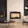 Insert à bois MONOBLOCCO 90PA.16 12,9 kW installé dans une cheminée moderne